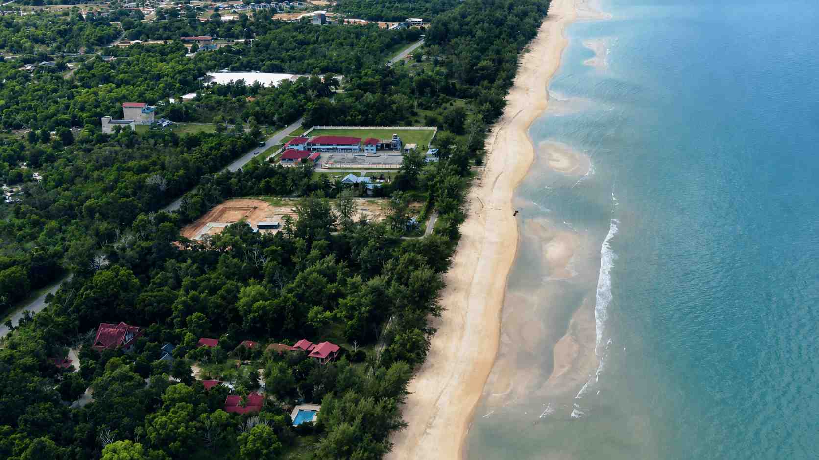 Sunrise over the beach at Pandan Laut Beach Resort in Terengganu